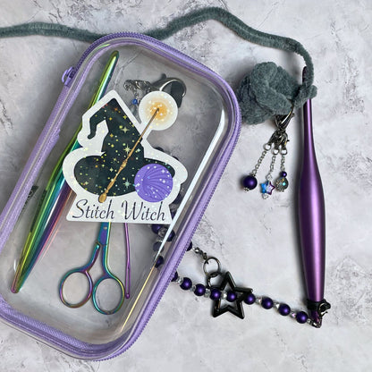 Purple sewing kit with scissors, pins, and a 'Stitch Witch' branded sticker.